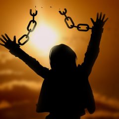 Freedom, silhouette of woman with broken chain on hands at sunset sky (Beauty and Fashion) freedom,silhouette,woman,backlighting,sky