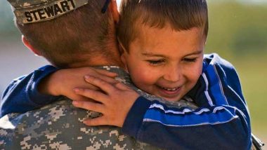 soldier hugging boy