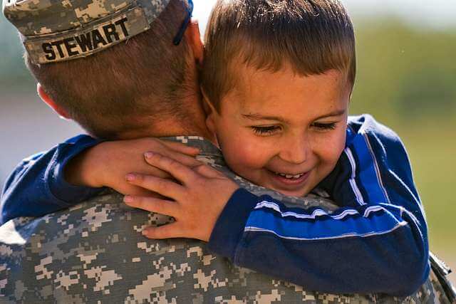 soldier hugging boy